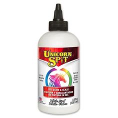 the bottle of unicorn spirit liquid is white with black cap on top and red bottom