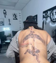 a person with a tattoo on their back