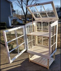 a small white house made out of wooden pallets