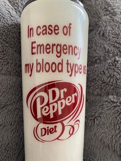 a red and white cup with the words in case of emergency, my blood type is diet