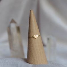 Aspire to always have a heart of gold. - Made with 14k gold filled material - 1mm thick band, 5x7mm heart shaped accent - Optional initial stamp You may experience a slight color difference in places where the metal has been soldered making every piece truly unique. If you do not see your size, please reach out to us by email at info@hellorising.com. We believe that everyone deserves to wear beautiful jewelry. Purchase three or more rings and save 15% with discount code 'ring15'. Click here to v Simple Heart-shaped Stackable Rings As Gift, Simple Heart Shaped Stackable Rings For Gifts, Simple Heart-shaped Stackable Rings For Gifts, Minimalist Tiny Adjustable Heart Ring, Tiny Adjustable Minimalist Heart Ring, Minimalist Double Heart Ring Gift, Minimalist Double Heart Ring For Gift, Minimalist Stackable Heart Ring For Promise, Minimalist Stackable Heart-shaped Jewelry