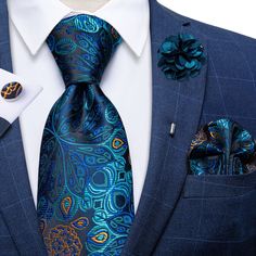 Treat yourself with a new pattern and splash of color to your look with this unique tie set. 100% Silk Handmade Package Includes: Tie, Pocket Square, Cufflinks & Flower Lapel. Length: 59" Width: 3.34" Warm iron if needed We offer FREE International Shipping World Wide! Blue Elegant Suit And Tie Accessories For Formal Occasions, Blue Elegant Formal Sets, Elegant Blue Formal Sets, Elegant Blue Suit And Tie Accessories For Wedding, Elegant Blue Cufflinks For Business, Elegant Blue Sets For Groom, Elegant Sets With Ties As Gift, Elegant Royal Blue Groom's Set, Elegant Royal Blue Groom Sets