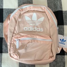 Nwt Adidas Backpack. Pale Pink With White Adidas Lettering And Emblem. So Cute! Must See In Person. White Zipper And Pulls. All Tags Attached ! Smaller Size Backpack Pink Bookbag, Rose Gold Adidas, Adidas Backpack, Adidas Baby, Backpack Outfit, Adidas Bags, Custom Handbags, Backpack For Teens, Light Backpack