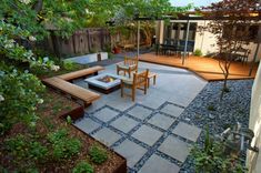 an outdoor patio with wooden chairs and tables