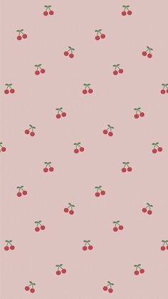 a pink wallpaper with cherries on it and green stems in the middle,