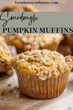 some muffins that are sitting on a wooden board with the words sandnargh pumpkin muffins