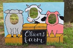 a wooden sign with two farm animals and a chalkboard that says clever's farm