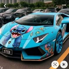 a blue car with cartoon characters painted on it