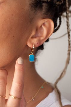 "Shiny turquoise earrings in huggie hoop earrings feature secure and smooth closure, all while adding a dainty pop of color with the turquoise gemstone. Dainty and simple gold hoop earrings, perfect for stacking and layering with your favorite accessories. Add a touch of boho vibe to your Valentines Day Gift selection with our beautiful gold turquoise earrings effortlessly. Inspired by royal blue turquoise gemstone and the simplicity of gold hoop earrings, we've created elegant Bella open hoop e Blue Gold Plated Hoop Jewelry, Turquoise Gold Plated Jewelry With Matching Earrings, Elegant Turquoise Huggie Earrings Gift, Turquoise Gold Plated Drop Earrings, Blue Tarnish Resistant Huggie Jewelry, Turquoise Gold Plated Dangle Jewelry, Blue Tarnish-resistant Huggie Jewelry, Turquoise Hoop Gemstone Jewelry, Turquoise Gemstone Hoop Jewelry