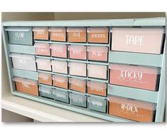 a shelf with many different types of labels on it and labeled in pink, blue, orange, and white