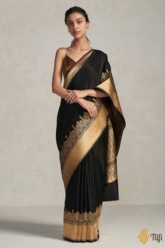 "\nA spellbinding Banarasi dream - simple yet classic! An elegantly woven satin silk saree that is perfect for any occasion.\u00a0A mesmerising silken weave with a beautiful Kadhua border and aanchal\u00a0with Mughal inspirations.\n\u00a0\n\n\nColor\u00a0-\u00a0An always stunning\u00a0shade of\u00a0Black\n\nTechnique\u00a0-\u00a0An enduring Kadwa weave. The elaborate and laborious Kadwa (Kadhua) technique involves hand-weaving each motif separately. It takes longer on the handloom, but makes a more robust pattern, which stands out on the fabric.\n\nFabric\u00a0- Soft as butter, pure Satin Silk\u00a0\n\nSpeciality\u00a0- A\u00a0gorgeous plain\u00a0satin silk body woven in the finest kadhua style\u00a0with a\u00a0traditional border and pallu. A quintessential Banarasi masterpiece.\n\nTilfi P Satin Silk Saree, Plain Saree, Black Pure, Indian Attire, Satin Silk, Handloom Saree, Shades Of Black, Blouse Piece, Black Silk