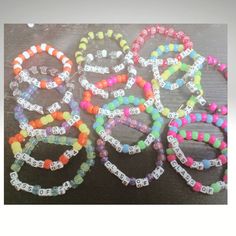 several bracelets with numbers on them sitting next to each other