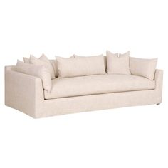 a white couch with several pillows on it's back and arms, against a white background