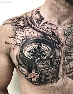 a man with a compass tattoo on his chest and chest is shown in this image