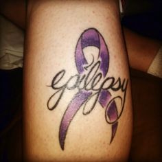 a woman's leg with a purple ribbon and the word epilepy on it