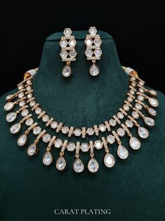 This gorgeous kundan polki set is made keeping in mind the Elegance of an Indian bride. Keeping the look heavy with simple earrings. Details : Made of premium quality uncut kundan polki . Gorgeous fine quality lab diamonds studded necklace with Rose Gold  rhodium plating and matching Earrings Item contains: Necklace and earrings AAA quality cubic zirconia used. Highest quality and craftsmanship Necklace Fitting is adjustable Earrings Closure: Pushback Necklace Closure: Adjustable tread tassel  D Necklace Closure, Traditional Necklace, American Diamond Jewellery, Kundan Set, Polki Necklace, Silver Wedding Jewelry, Studded Necklace, Polki Jewellery, Jewelry Care Instructions