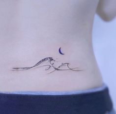 a woman's stomach with a small bird tattoo on her left side ribcage