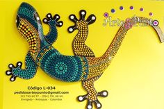 an image of a lizard made out of beads on a yellow background with the words art and design written below it