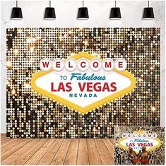 the welcome sign for las vegas is displayed in front of a wall with disco lights