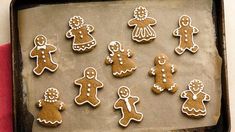 a baking pan filled with cut out ginger cookies