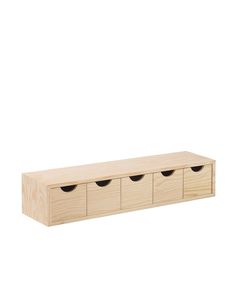 a wooden shelf with four drawers and three black knobs on the bottom, against a white background