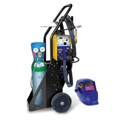 a machine that is sitting on top of a cart next to a blue helmet and other items