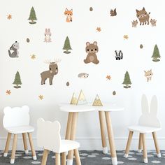 children's wall stickers with woodland animals and trees on the walls in a playroom