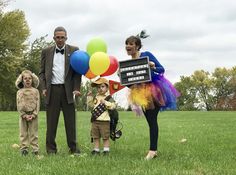 a family dressed up in costumes for halloween