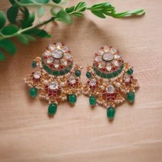 Silver Moissanite Polki Chandbali Earring, Emerald Earring, Kundan Chandbali, Bridal Chandbali Earring, Traditional Jewellery, Chandbali *𝐀𝐛𝐨𝐮𝐭 𝐏𝐫𝐨𝐝𝐮𝐜𝐭* Product Code :- TE 1035 Product Type :- Chandbali Earring Product Weight :-  Gemstone Used :- Moissanite Polki, Labmade Emerald & Ruby Material :- 925 Sterling Silver, Moissanite Polki, Labmade Emerald & Ruby, Enamel Size :- 5.5x3 Cm Intricate, hand-crafted, Pure Silver Polki Earrings, studded with high-quality Moissanite Polki comes with Push back, made in 92.5 silver with 22ct gold plating. The product comes with 92.5 silver stamping -Product can be made in gold as well. -If any product is not ready, It takes 2-3 weeks to make in pure silver -We also look forward to Bulk Orders. We shall consider special discount on Bulk Orde Traditional Green Earrings For Reception, Green Chandbalis For Diwali Reception, Traditional Latkans Earrings For Reception, Green Chandbalis For Reception And Festivals, Green Earrings For Reception And Festivals, Green Earrings For Reception And Festive Occasions, Traditional Meenakari Pearl Earrings For Reception, Traditional Round Chandelier Earrings For Reception, Traditional Earrings For Reception