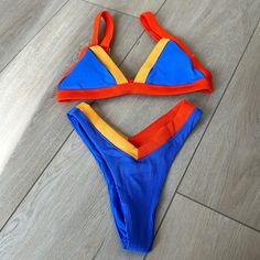 Oneone Swimwear Orange And Blue Bikini, Like New. Top: Medium Bottom: Small Summer Blue Color Block Swimwear, Vibrant Blue Swimwear For Vacation, Blue Color Block Swimwear For Poolside, Vibrant Orange Swimwear For Swimming, Vibrant Blue Triangle Top Swimwear, Vibrant Orange Triangle Top Swimwear, Orange Color Block Swimwear For Beach Season, Vibrant Fitted Blue Swimwear, Orange Color Block Summer Swimwear