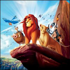 the lion king is standing on top of a cliff