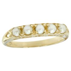 The ring showcases five round natural white pearls set in a solid yellow gold band, contributing to the vintage appeal of the piece. This classic and elegant jewelry is perfect for any occasion, offering versatility that allows it to be dressed up in your special events or down in your everyday look. CHARACTERISTICS Status: Made to order Origin: Thailand Metal: Solid 9K Yellow Gold Ring Size: US 3-8 Total Gemstones Weight: 0.70 carat. (approx.) Total Gram Weight: 2.10 g. (approx.) *Pictures have Classic Hallmarked Pearl Ring, Classic 14k Gold Pearl Ring, Classic Yellow Gold Pearl Ring With Round Band, Classic Yellow Gold Hallmarked Pearl Ring, Classic 14k Gold Pearl Ring Hallmarked, Classic 14k Gold Hallmarked Pearl Ring, Pearl Set, Natural Pearl, Gold Band