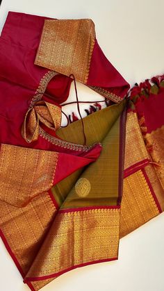 Our Unique collections : This saree is a fine weave - Pure kanchi pattu hand woven beauty with butta all over the body and heavy golden pattu for a beautiful bride. Paired with Hand embroidered blouse, ready to wear. Fine weave Grand pallu flower butta all over the body . And with hand embroidered blouse pure silk Color Mehandi green to maroon Comes with hand embroidered blouse size 36 goes up to size 42-44 Color :Mehandi green to maroon Weight : 600 - 800 grams Length : 5.5 m saree + 0.7 m blouse Width : 48 Inches Fabric : Pure Kanjivaram Pattu Plain Silk Craft Description : Kanjivaram, Kanjeevaram Wash Care : Dry Wash Only Shipping Time : 5 - 7 Working days We Ship Worldwide WHAT IS A KANCHI PATTU SAREE ? Hand Embroidered Blouse, Kanjivaram Silk Saree, Pattu Saree, Embroidered Blouse, Turks And Caicos Islands, Beautiful Bride, Pure Silk, Silk Saree, Hand Woven