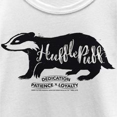 a white shirt with an image of a badger and the words huffle park on it