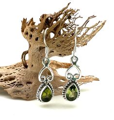 Peridot Silver Earrings / Peridot Bead Earrings / August Birthstone / Peridot Earrings/ Sterling Silver Drop Length: 18mm Beautiful green peridot set in sterling silver. Perfect size for everyday and any occasion. Sterling Silver Natural Peridot Lightweight Please visit my shop for my complete collection! jewelsbymikinamiki.etsy.com Silver Peridot Jewelry With Gemstone, Silver Peridot Drop Earrings, Dangle Peridot Gemstone Earrings, Classic Green Peridot Earrings, Silver Faceted Peridot Jewelry, Bali Earrings, Peridot Earrings, Green Peridot, Pinky Ring