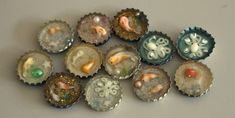 there are many small bottle caps that have animals on them, and fish in them