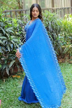 Blue pre-draped saree with an attached cancan and mirror, cutdana and floral hand embroidery. Comes with a padded blouse. - Aza Fashions Traditional Blue Blouse Piece For Evening, Traditional Drape Blue Blouse Piece For Evening, Blue Traditional Drape Blouse For Evening, Designer Blue Pre-draped Saree, Blue Bollywood Draped Blouse Piece, Blue Draped Bollywood Blouse Piece, Blue Draped Blouse Piece With Zari Work, Bollywood Style Draped Blue Blouse Piece, Blue Pre-draped Saree For Festive Occasions