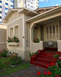 a house with red steps leading up to it