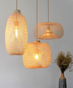 three hanging lights made out of woven material