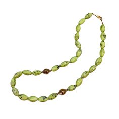 This bright lemon chrysoprase beaded necklace is a celebration of this beautiful light green stone. It is strung with two of our signature crownwork® finials and finished with an 18k yellow gold lilypad clasp. This one of a kind piece looks great layered with other necklaces or worn as a statement on its own. MATERIAL: 18k Yellow Gold STONE TYPE: Lemon Chrysoprase DIMENSIONS: 20" 18th Wedding Anniversary, Gold Stone, Summer Jewelry, Green Stone, Beautiful Lights, Lily Pads, Finials, Precious Metals, Ring Earrings