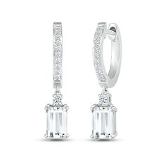 These mesmerizing earrings showcase a dangling emerald-cut white lab-created sapphire topped by a sparkling round white lab-created sapphire. The drop hangs from a sterling silver hoop adorned in more round white lab-created sapphires for all-over sparkle. The earrings secure with hinged backs. Modern White Diamond Hoop Earrings, Luxury White Emerald Cut Earrings, Modern Baguette Cut White Diamond Earrings, White Baguette Cut Diamond Earrings, Modern White Baguette Cut Diamond Earrings, Modern White Brilliant Cut Hoop Earrings, Luxury White Dangle Hoop Earrings, White Dangle Hoop Earrings In Fine Jewelry Style, Modern White Baguette Cut Earrings