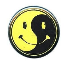 a black and yellow smiley face with a smile on it's face in the shape of a yin - yang symbol