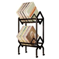 a magazine rack with magazines on it and two shelves stacked high up against each other