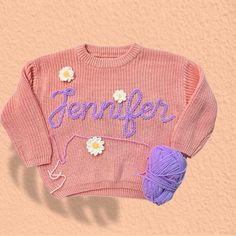 Newborn Gifts, Personalized Baby Sweater, Hand Embroidered Sweatshirt Baby, Baby Christmas Gifts, Kids Gifts, Baby Shower Gifts For Girls This embroidered knit sweater--an ideal choice for celebrating the journey into motherhood or commemorating a baby shower. Crafted with exquisite attention to detail, this sweater combines warmth with timeless style, making it suitable for gifting on birthdays, during the festive season, and throughout the transitional seasons of Winter, Autumn, and Spring. Its versatile nature ensures it's not just a garment but a cherished keepsake for both mother and child. ABOUT THIS ITEM: PERSONALIZED: You can custom name on your sweater. Let's add the name in personalized box and creat special gifts for loved one. MATERIAL: This knit sweaters are made with high-qua Baby Shower Gifts For Girls, Hand Embroidered Sweatshirt, Baby Christmas Gifts, Baby Christmas, Baby Sweater, Knit Sweaters, Gifts Baby, Gifts Personalized, Embroidered Sweatshirt