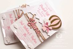 two pink and white birthday cards on top of each other