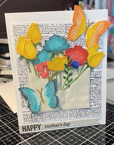 a card with flowers and butterflies on it