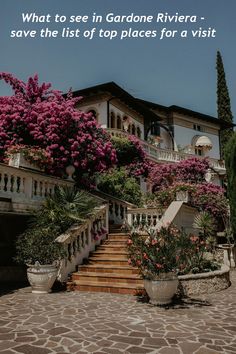 an image of a house with stairs and flowers on the steps that lead up to it