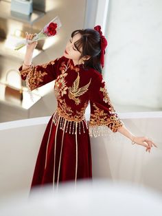 ⭐⭐ This Dress is stunning for Brides who wants to have a traditional Chinese Wedding celebration. Vivid Wine Red with Classical Chinese Artistic Embroidery Flowers on top and the sleeves; Exclusive Pearl Tassel decoration over the gown; Long tassel string for elegant and unique look; Wine Red in China Stands for Joy and Happiness for the bride and groom. Made with Italian Solid Shiny Velvet Satin; Made Fullness of Woman S Shape; ⭐ This dress can be custom size made. Please offer your measurement Traditional Embroidered Cheongsam For Wedding, Traditional Ao Dai For Festive Banquet, Traditional Ao Dai For Festive Banquets, Traditional Red Cheongsam For Wedding, Traditional Red Wedding Cheongsam, Red Embroidered Ceremonial Gown, Traditional Embroidered Dress For Banquet, Traditional Embroidered Gown For Banquet, Traditional Embroidered Gown For Banquets