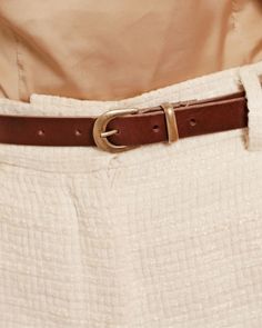 Accent your outfit with the perfect subtle statement belt. This ultra-skinny leather accessory features matte gold hardware on it's slender physique. This classic leather belt for jeans & dresses is a great value to last years of styling fun. Amsterdam Heritage is a leader in fashionable belts for women providing a variety of colors & widths for the fashionista in you. PRODUCT DETAILS Width: 0.8"Material: Full-Grain Italian LeatherBuckle: Gold Handmade Leather Belt in The Netherlands Belt For Jeans, Statement Belt, Handmade Leather Belt, Leather Accessory, Leather Buckle, Classic Leather, Matte Gold, Leather Accessories, Jeans Dress