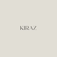 the word kraz written in black ink on a gray background with an image of a